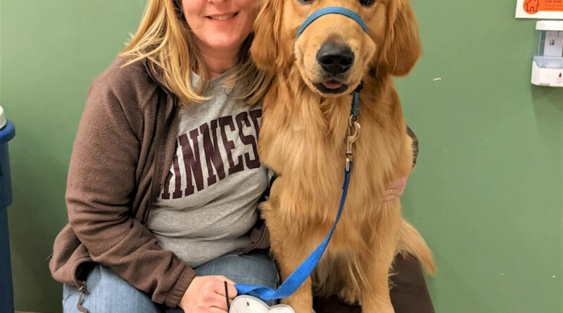 A slain Minnesota lawmaker’s beloved dog, Gilbert, stays with her as she and her spouse lie in state