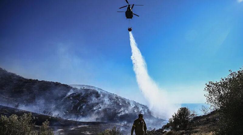 Homes burn in Greece as wildfire sweeps through coastal towns