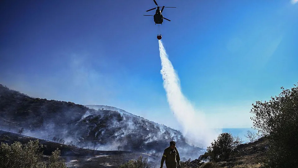 Homes burn in Greece as wildfire sweeps through coastal towns