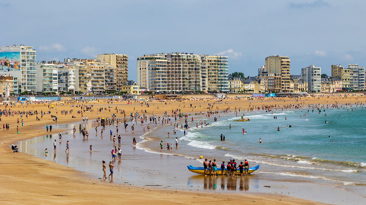 Beach town cracks down on half-naked tourists with hefty fines for inappropriate attire
