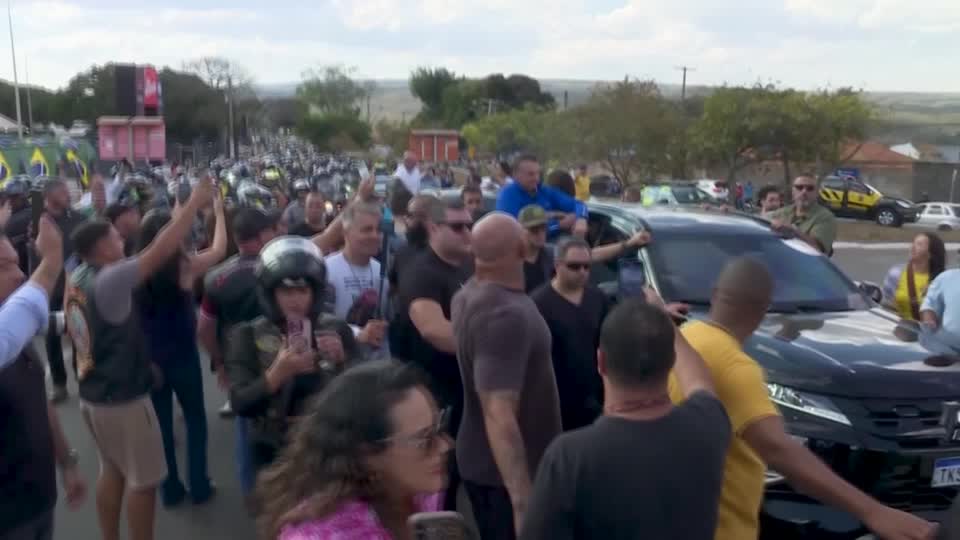 Hundreds join Bolsonaro in motorcycle rally amid coup trial tensions