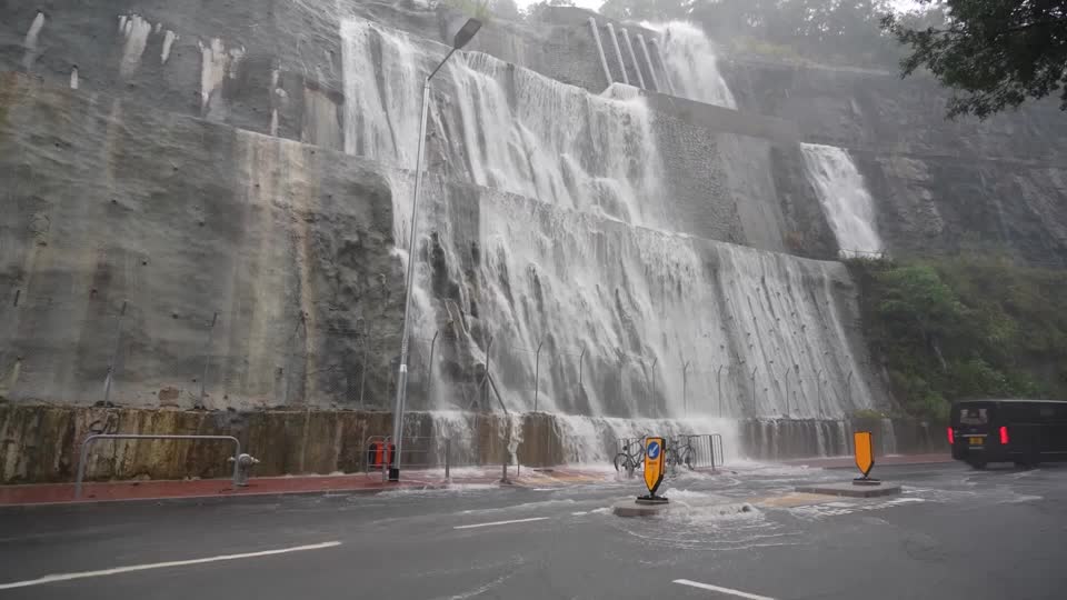 Intense rain creates a waterfall in Hong Kong