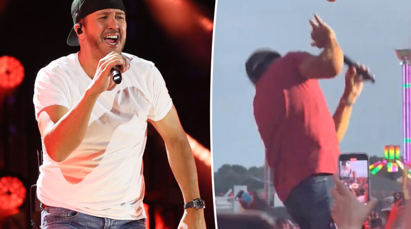 Luke Bryan responds after getting hit in the face with a ball mid-show