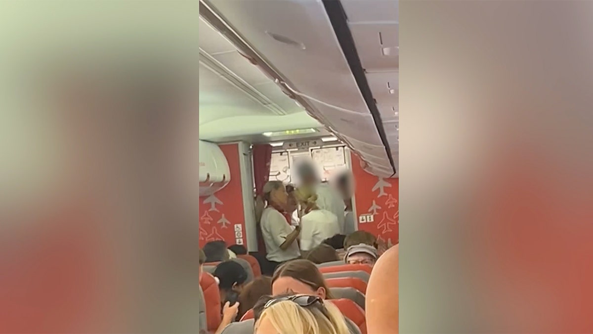 Passengers removed from plane, arrested for alleged vodka-induced drunk and disruptive behavior