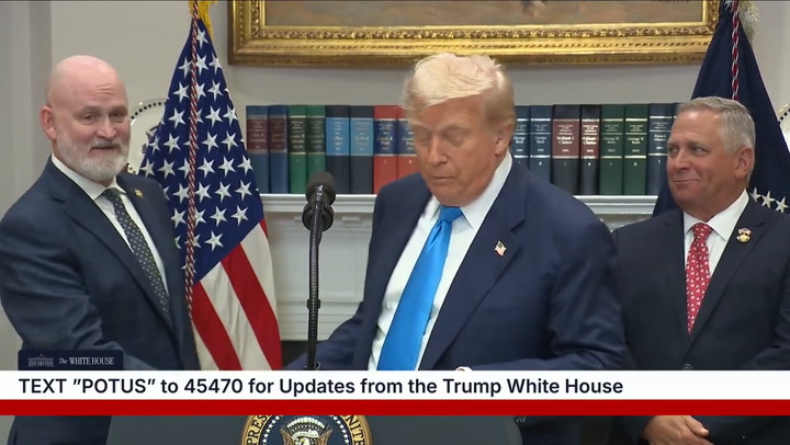 Standing just behind the president, MAGA Rep. Derrick Van Orden appeared to awkwardly mouth, “I’m here.”